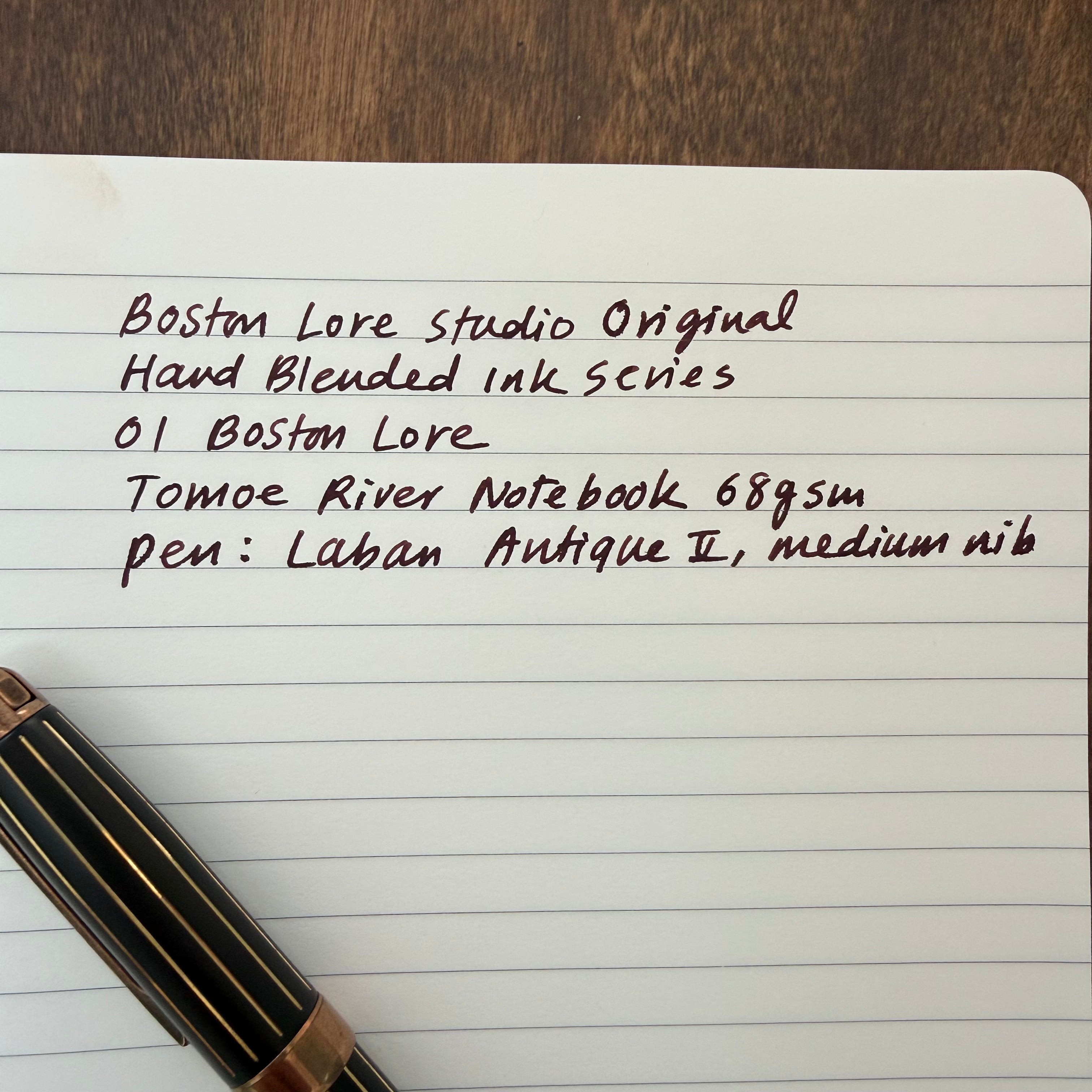 Detailed handwriting sample showing the dark burgundy-brown tones of 01 Boston Lore fountain pen ink