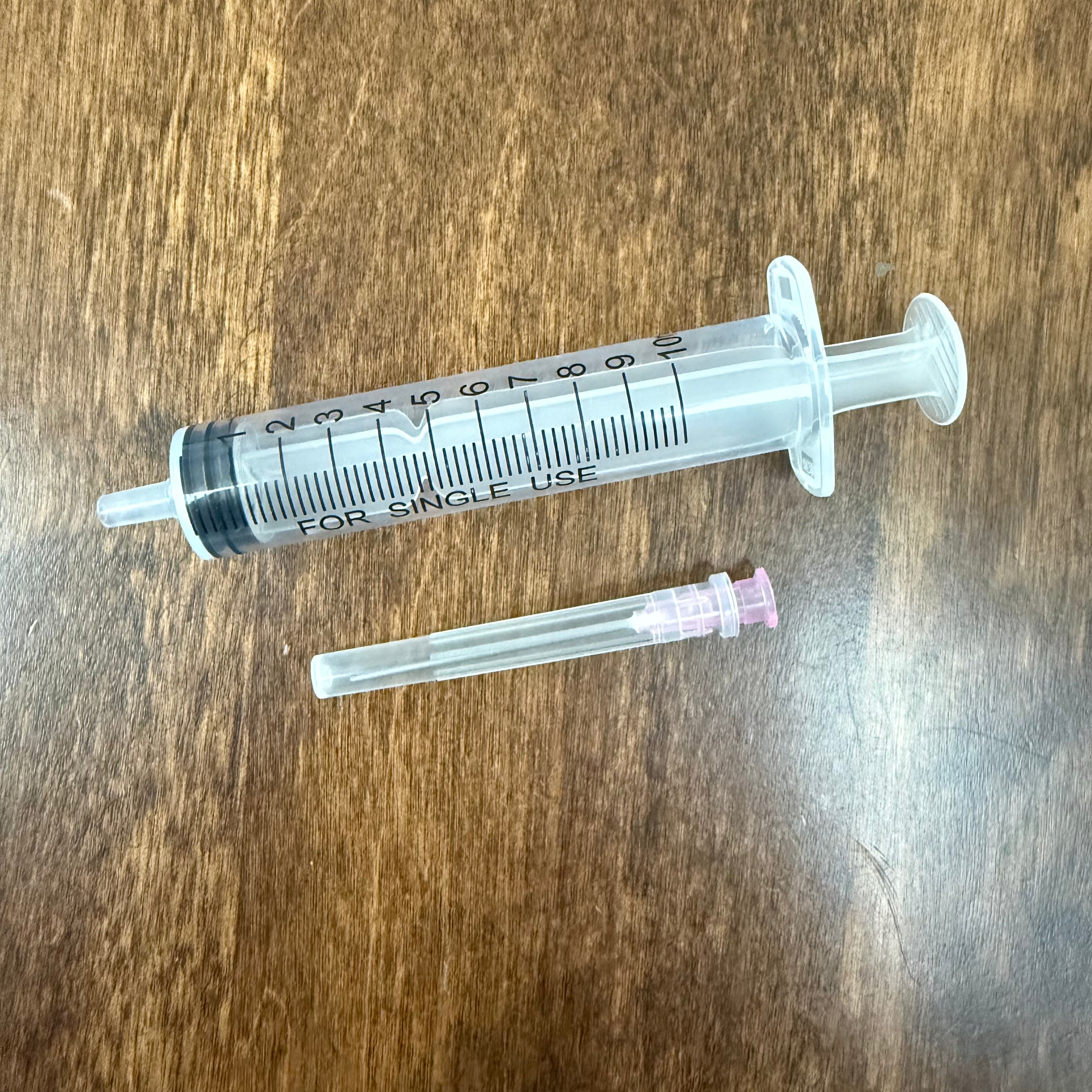 Graduated 10 mL syringe and removable metal tip for fountain pen ink transfer