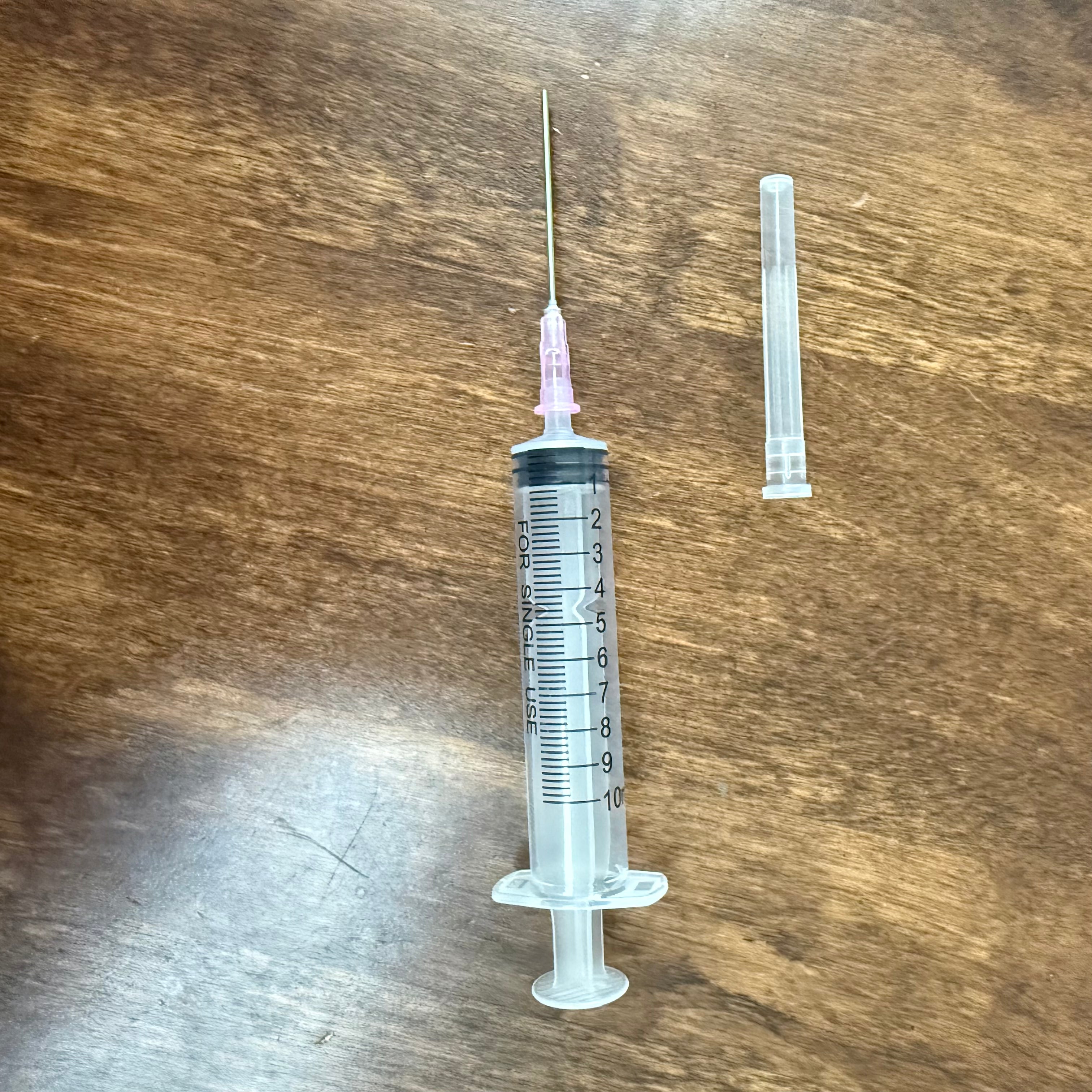 10 mL fountain pen ink syringe with blunt metal tip and protective cap