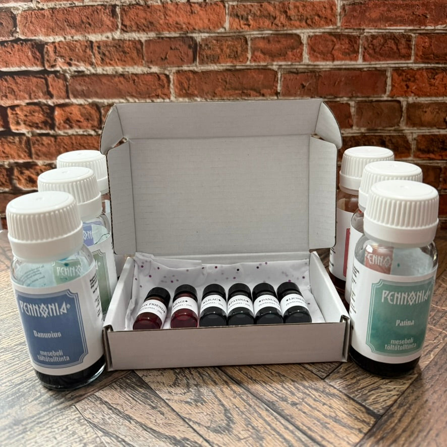 Pennonia ink sampler gift box shown with the full Pennonia bottles the inks were decanted from (bottles not included)
