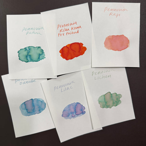 Handwritten swatch cards of the six Pennonia inks showing their shading: Patina, Roka Koma, Ragi, Danube, Lilac and Lichen