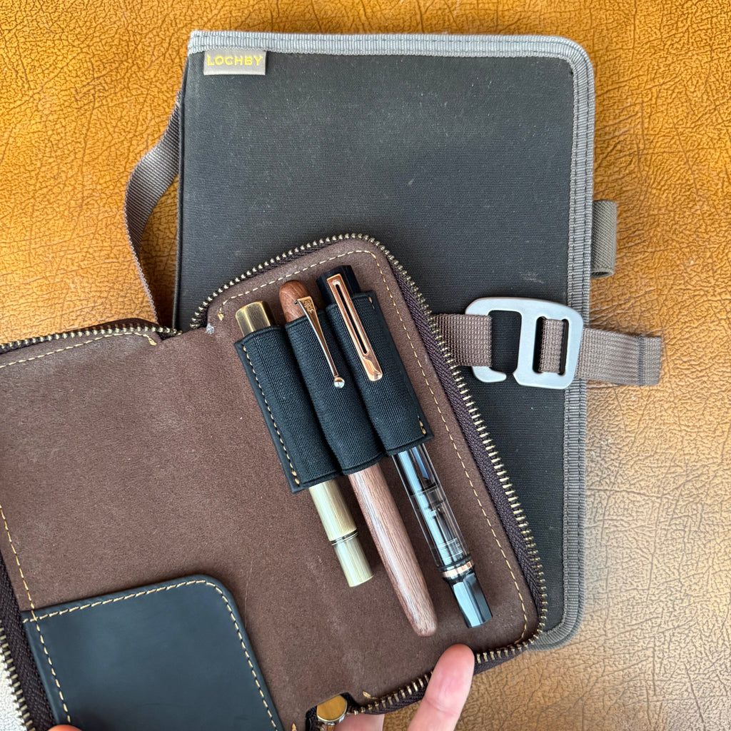 Leather 3-pen fountain pen case with pens and small writing accessories inside