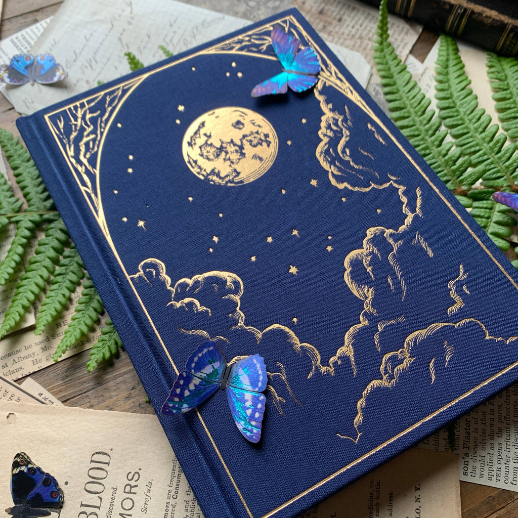 The Creeping Moon The Astronomer B6 notebook with dark blue linen cover and gold foil celestial design