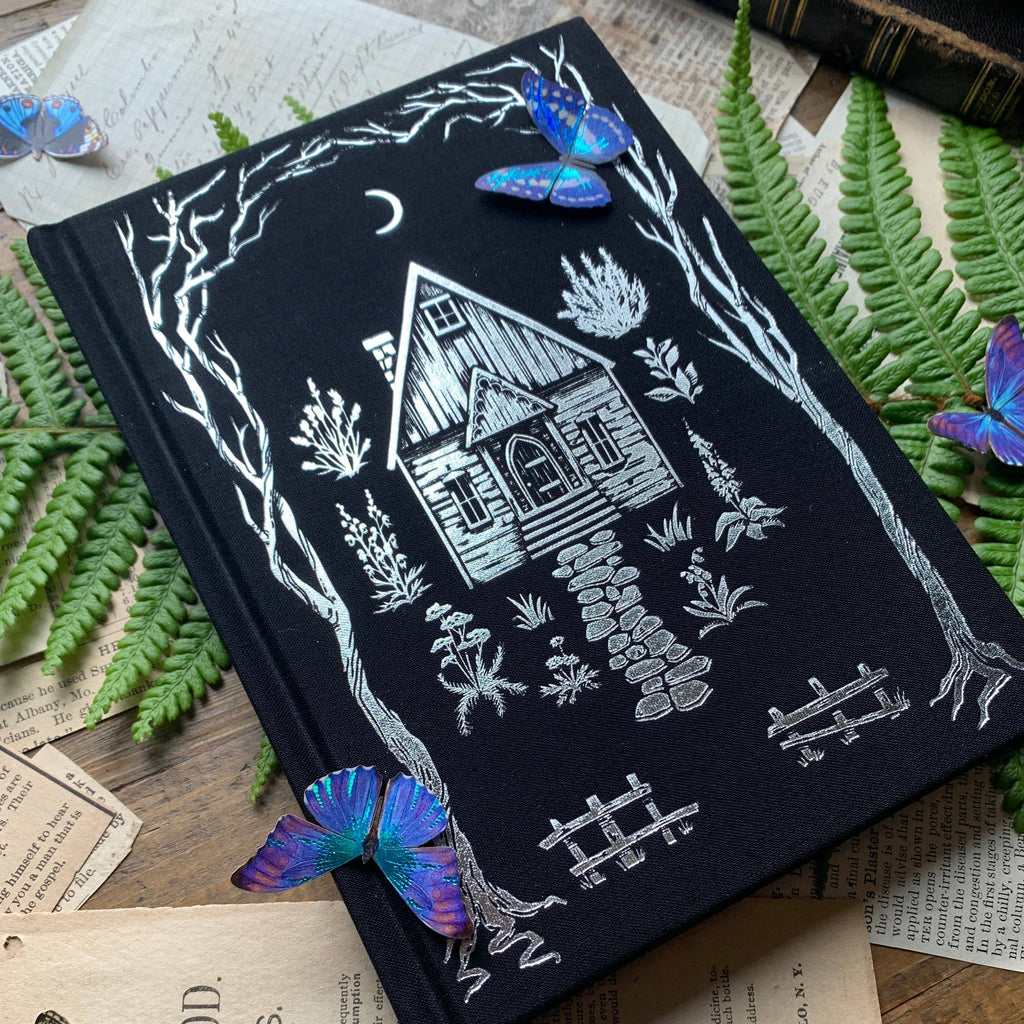 Gold foil cover and spine details on The Creeping Moon The Grimoire notebook