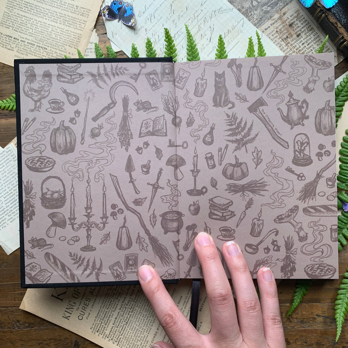 Illustrated endpapers inside The Creeping Moon The Grimoire B6 notebook