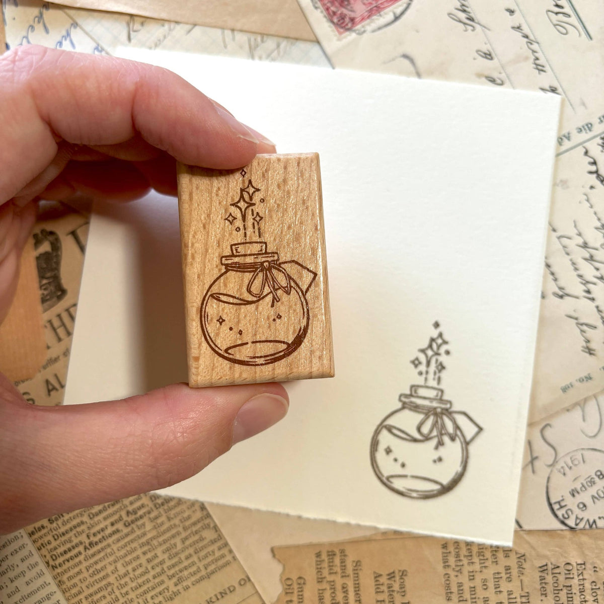 Potion bottle stamp impression by The Creeping Moon