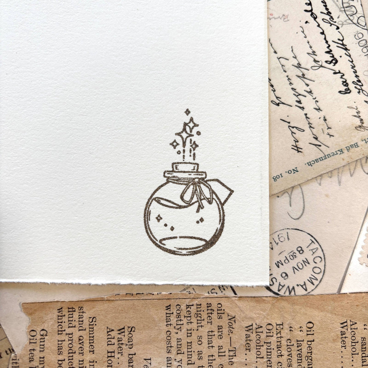 The Creeping Moon Potion Ink Bottle rubber stamp shown in use