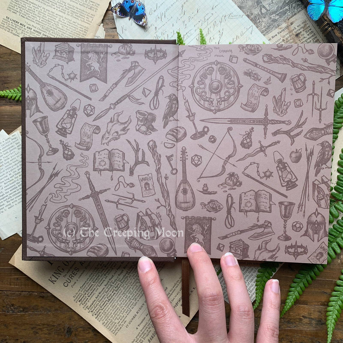 The Creeping Moon The Wanderer notebook, gold-foil cover detail