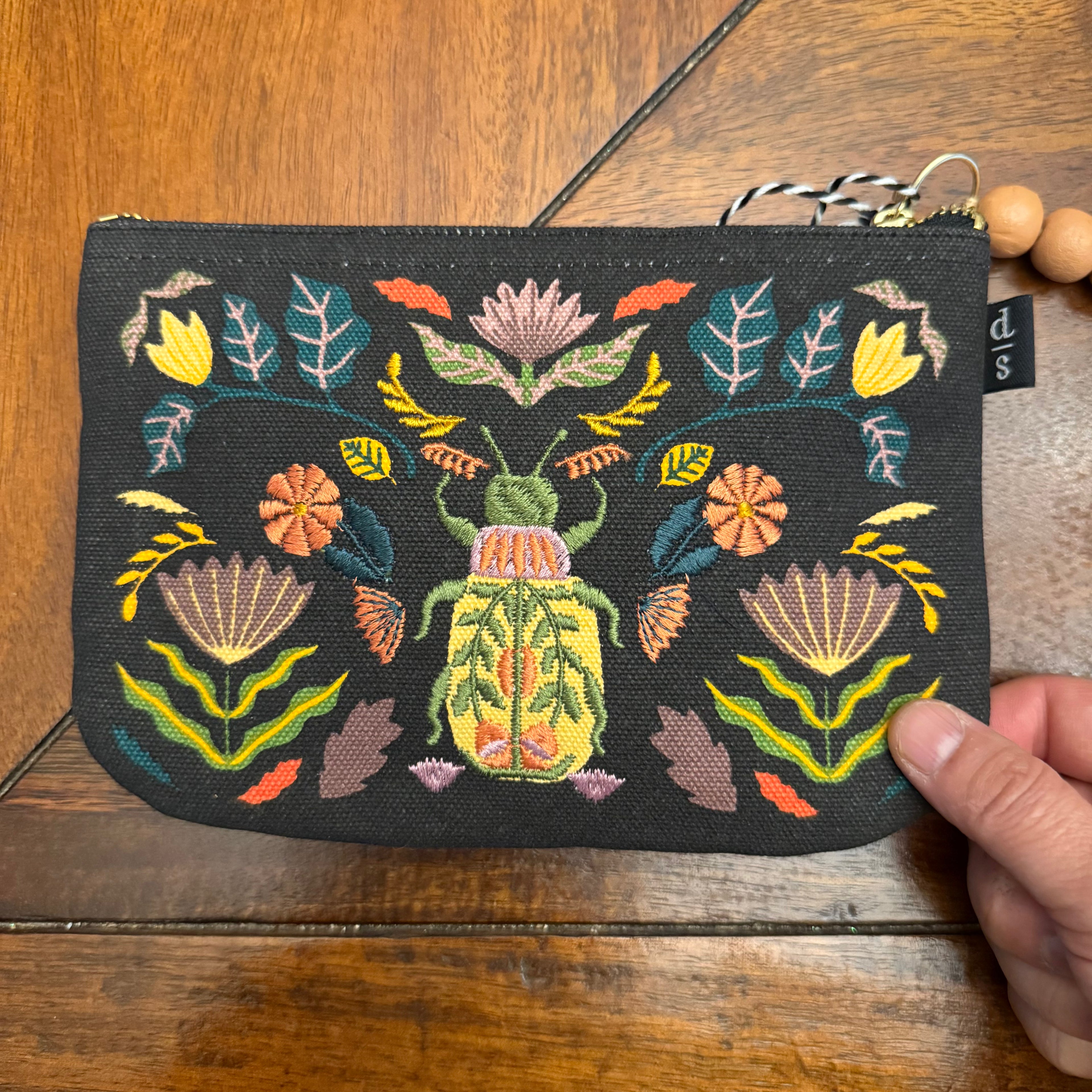 Danica Studio Amulet Small Zipper Pouch shown in hand for scale