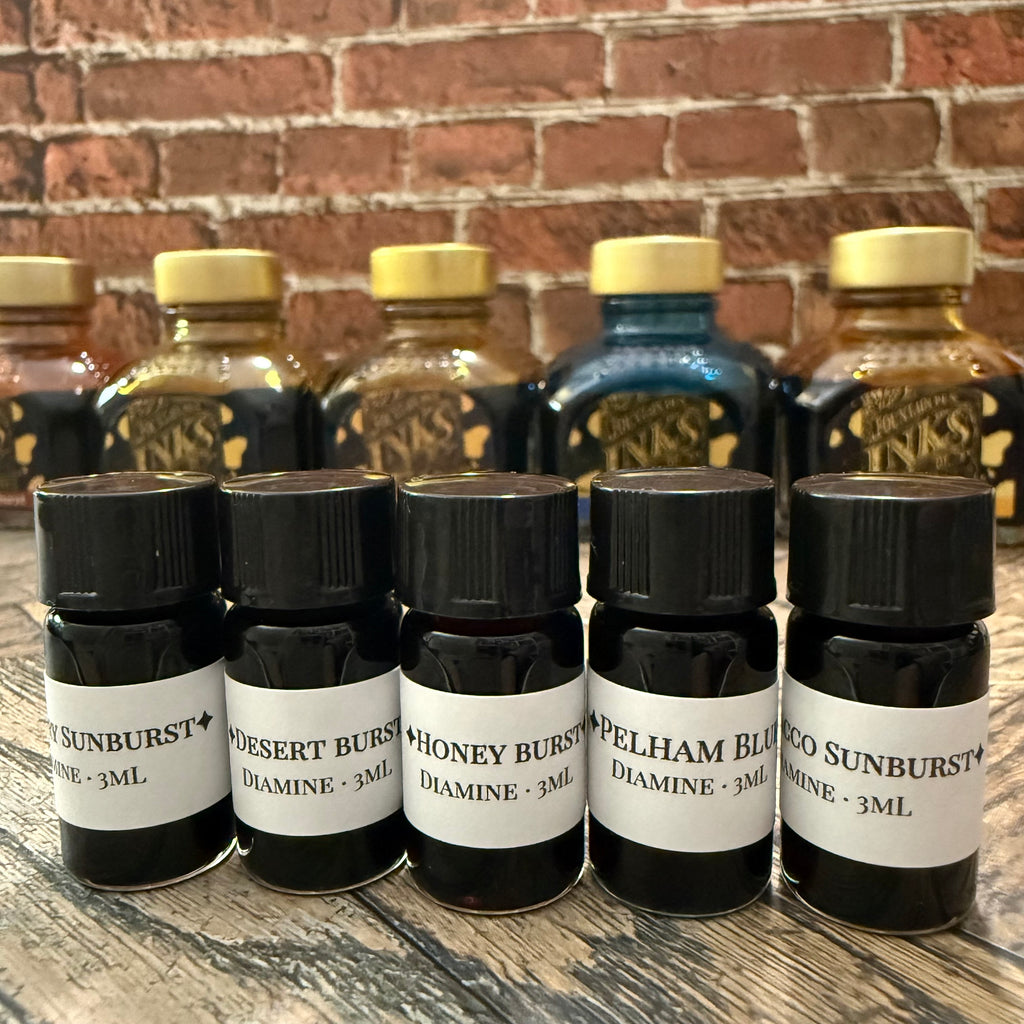Diamine Guitar 3 mL sample vials in front of the full 80 mL bottles they were decanted from (bottles not included)