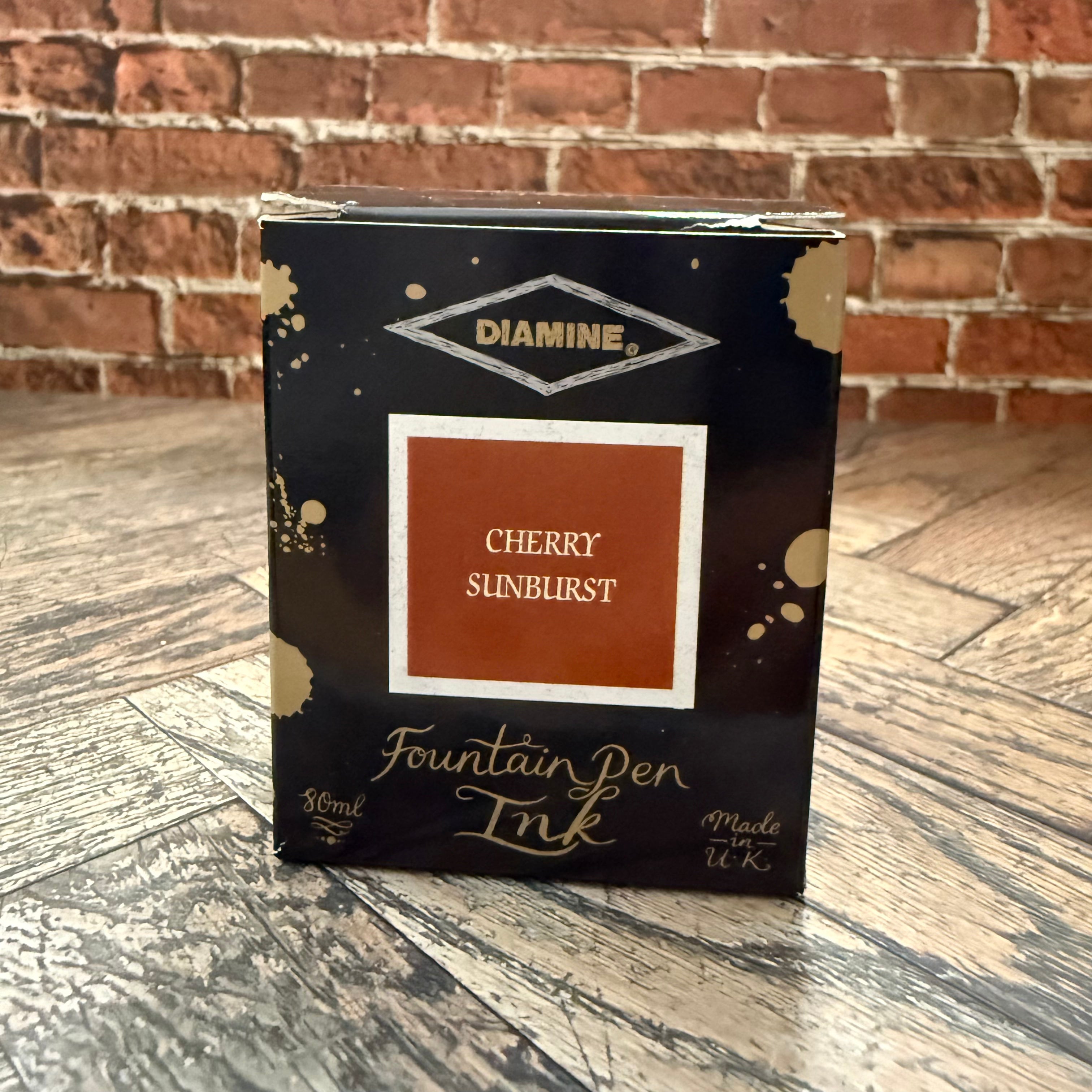 Diamine Cherry Sunburst 80 mL fountain pen ink box, black with gold ink splashes