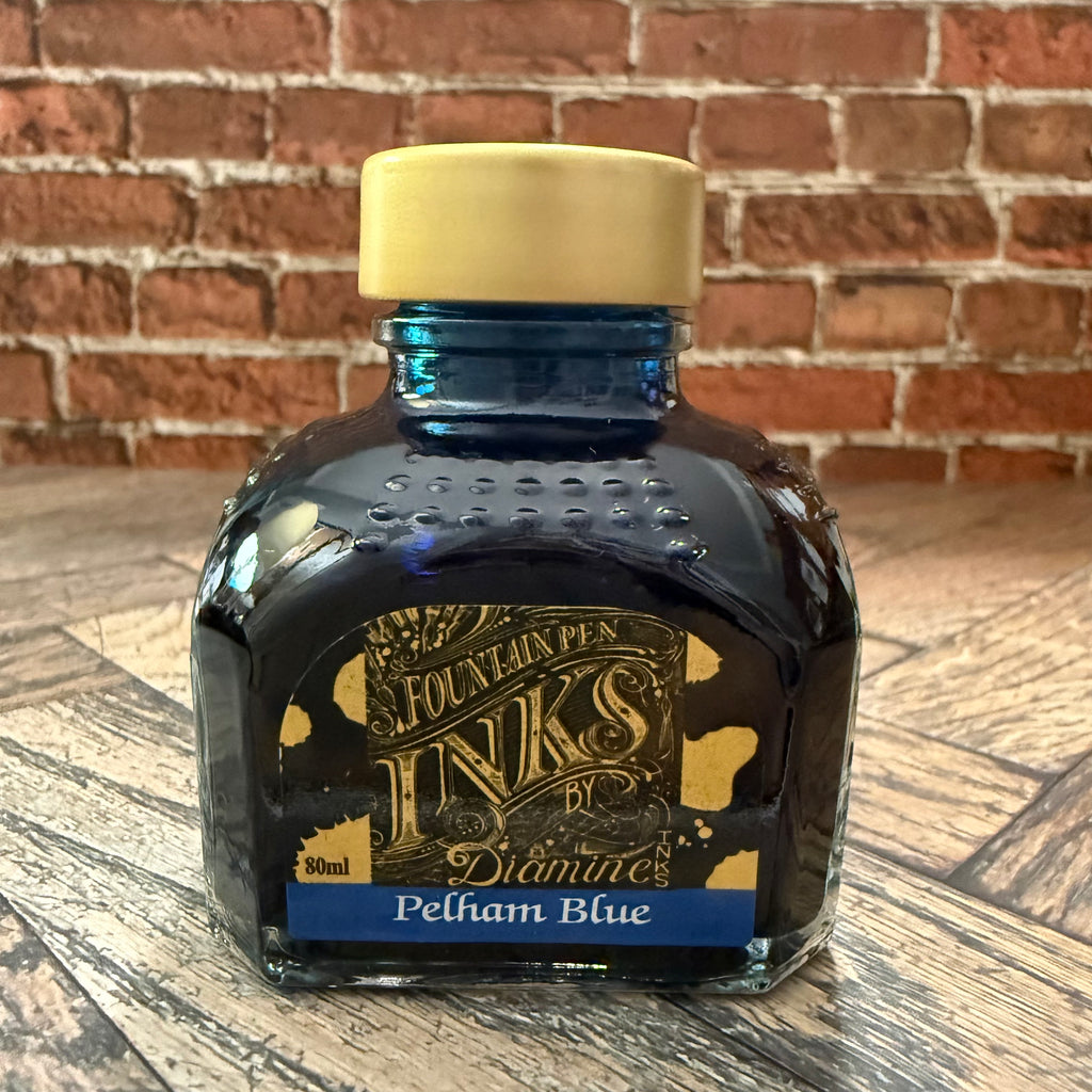 Diamine Pelham Blue fountain pen ink in an 80 mL glass bottle with a gold cap