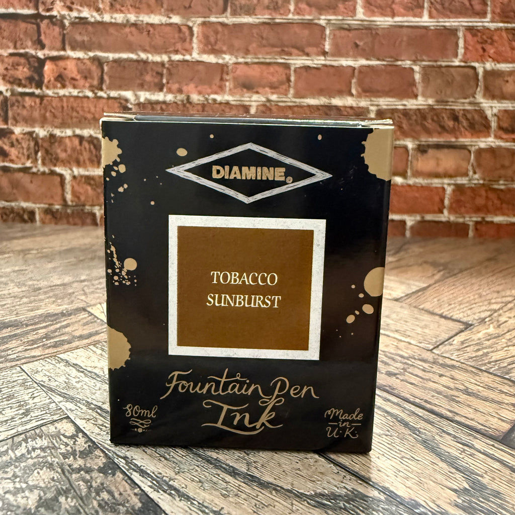 Diamine Tobacco Sunburst 80 mL fountain pen ink box, black with gold ink splashes