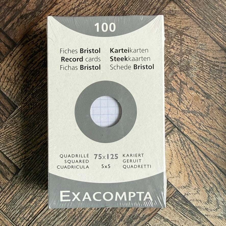 Front of an Exacompta Bristol record cards pack: 100 white 75 x 125 mm cards with a 5 mm square grid