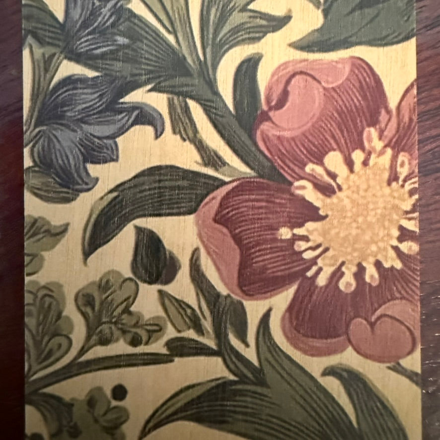Close-up of vintage floral botanical artwork printed on natural wood bookmark
