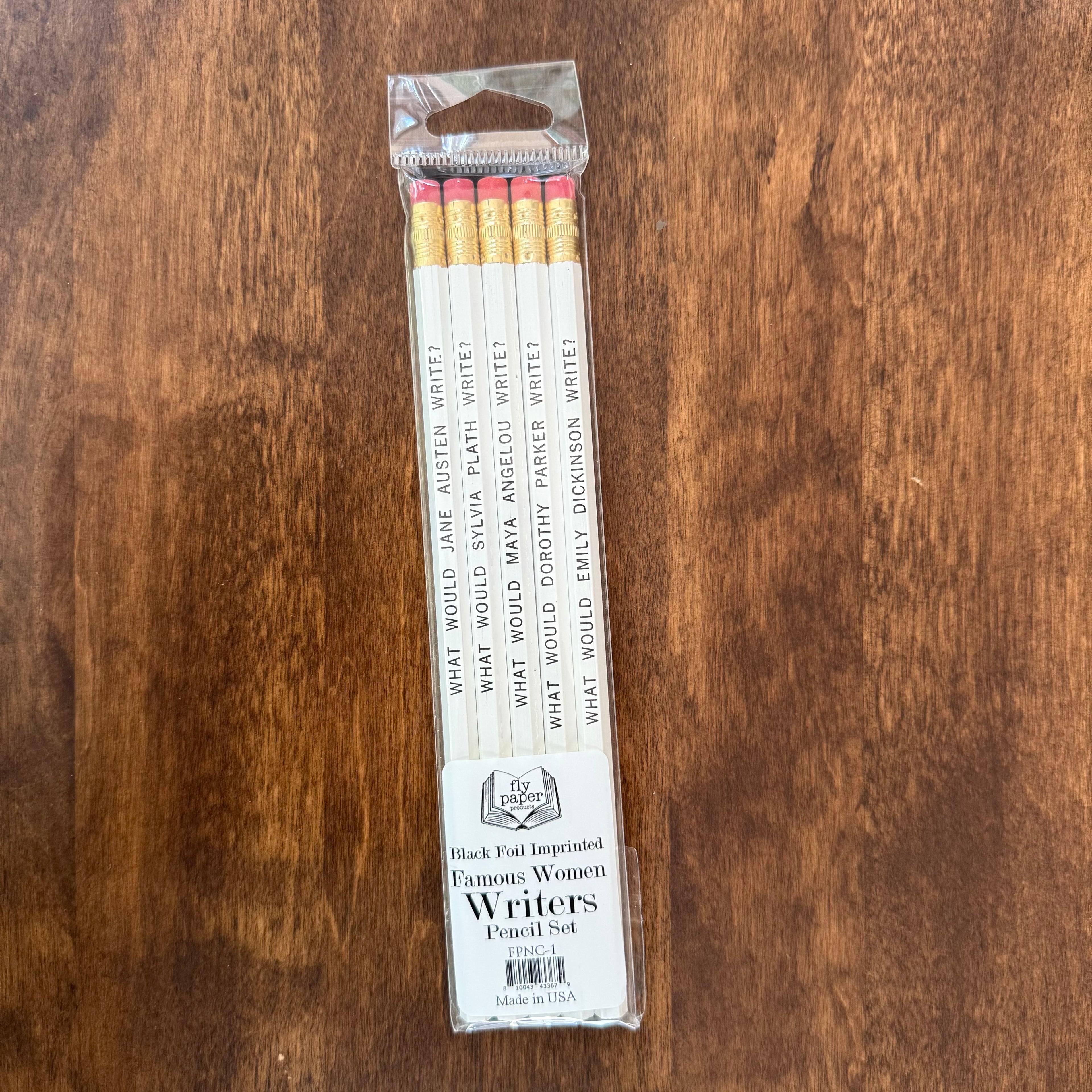 Fly Paper Products Famous Women Writers Pencil Set with five white literary pencils featuring Jane Austen, Sylvia Plath, Maya Angelou, Dorothy Parker, and Emily Dickinson.