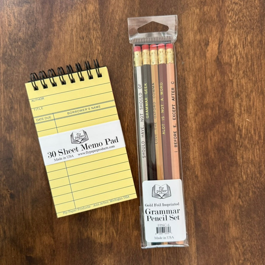 Grammar Pencil Set by Fly Paper Products beside a vintage library card memo pad and green fountain pen on a wooden writing desk.