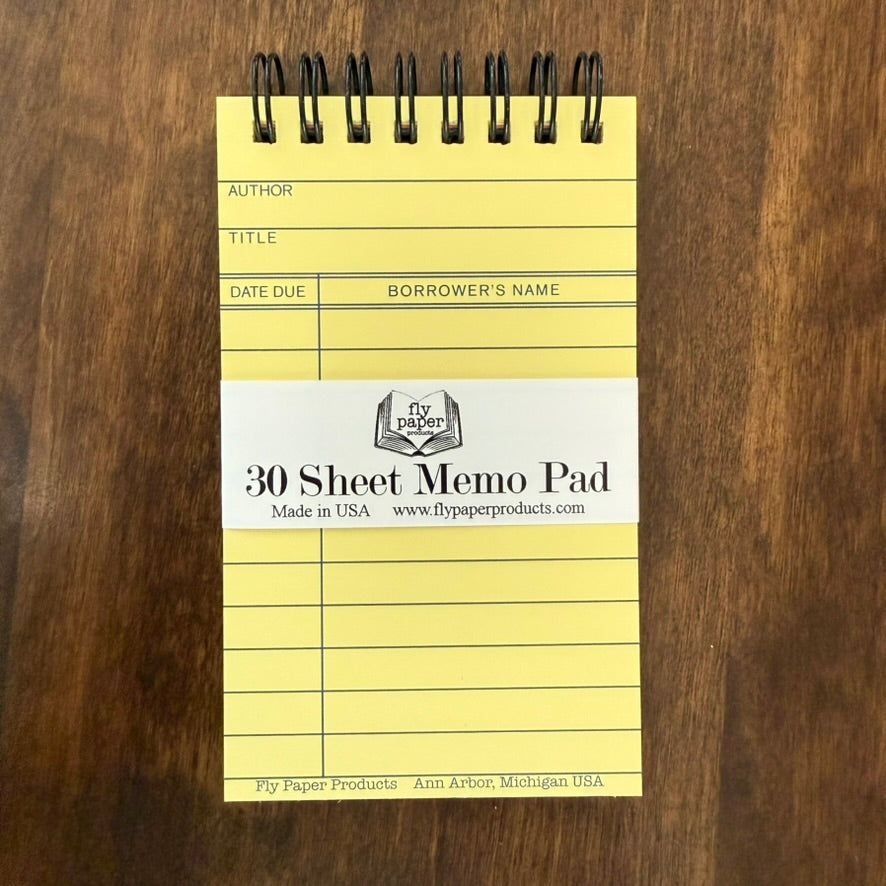 Vintage Library Card Memo Pad by Fly Paper Products with 30 spiral-bound sheets in a classic yellow library checkout card design.