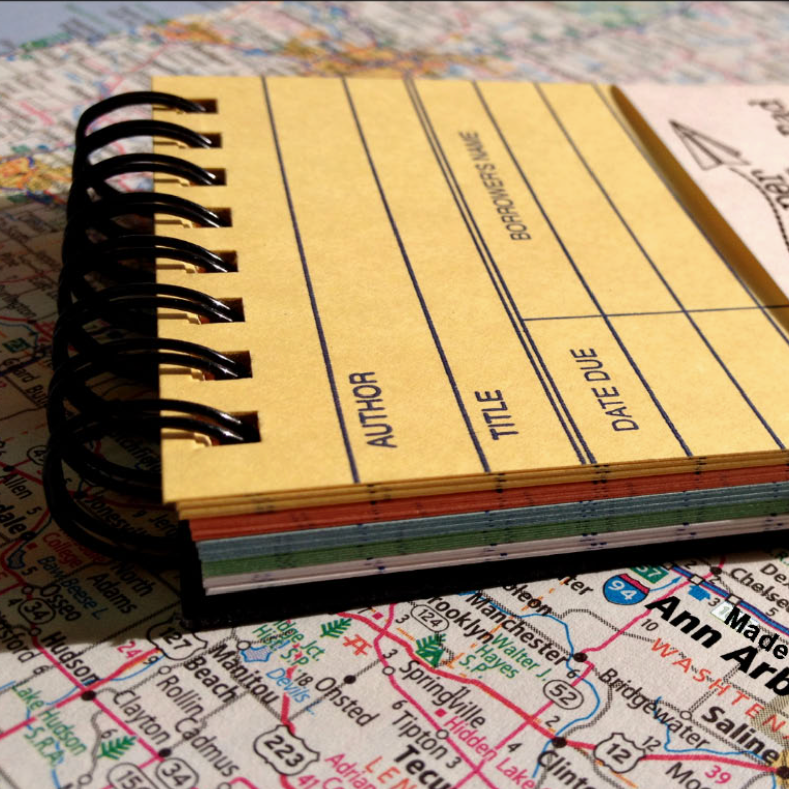 Close-up of the spiral-bound Vintage Library Card Memo Pad showing Author, Title, Date Due, and Borrower's Name fields.