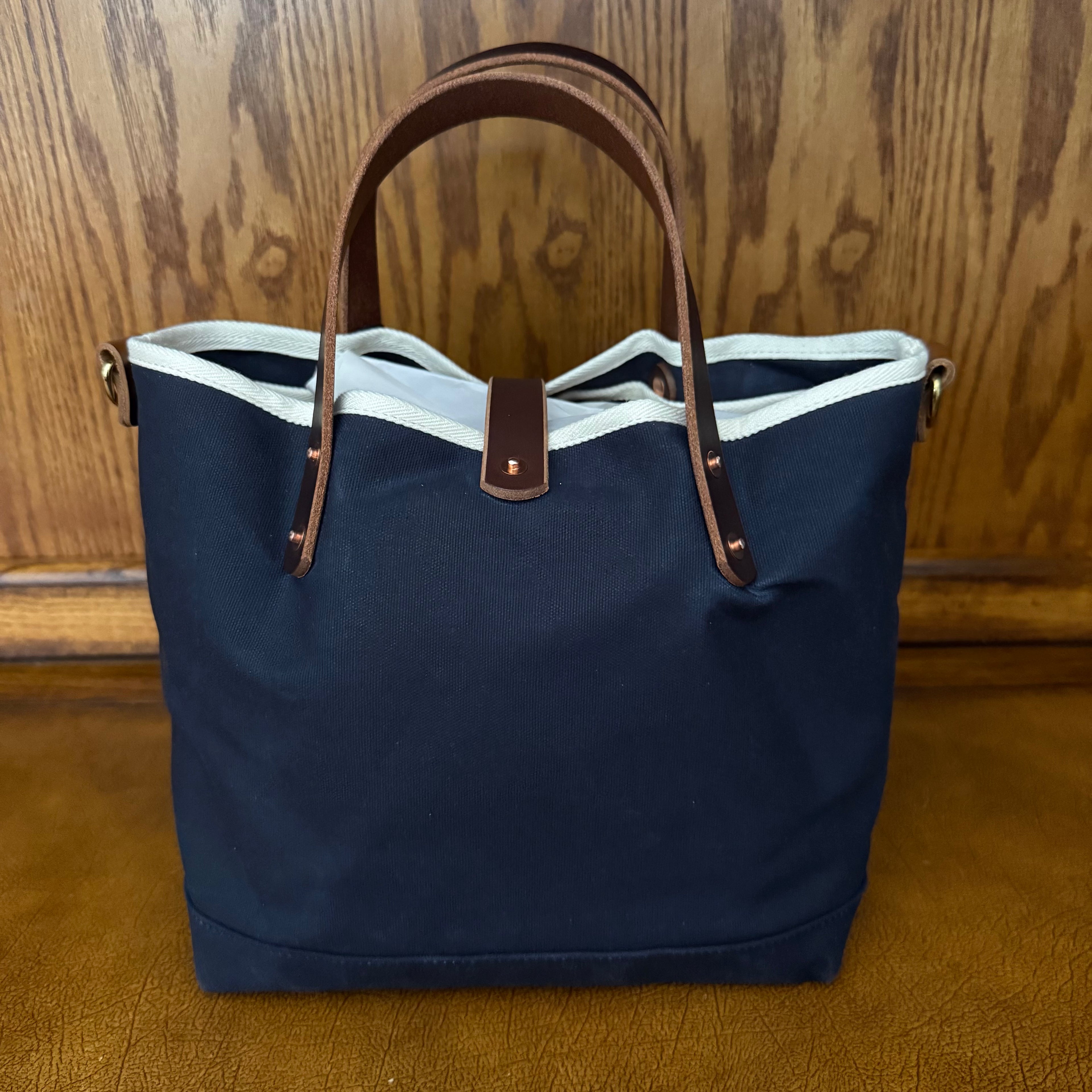 Rear view of General Knot & Co. True Navy waxed canvas All Day Mini Tote