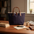General Knot & Co. True Navy waxed canvas All Day Mini Tote on a writing desk