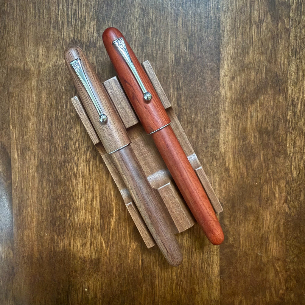 Rosewood and Walnut Jinhao 9035 wooden fountain pens shown side by side