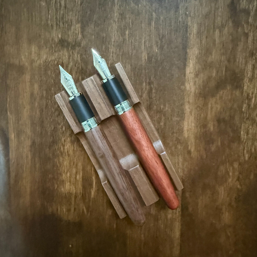 Jinhao 9035 Walnut fountain pen uncapped beside the Rosewood finish