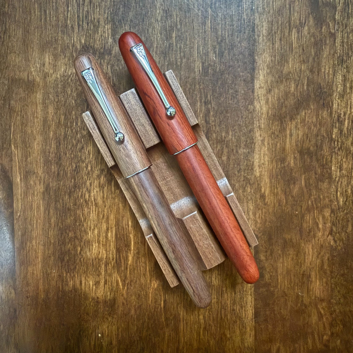 Walnut and Rosewood Jinhao 9035 wooden fountain pens shown side by side
