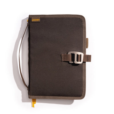 Brown Lochby Field Journal closed, showing the waxed canvas cover, hand strap, and metal clasp