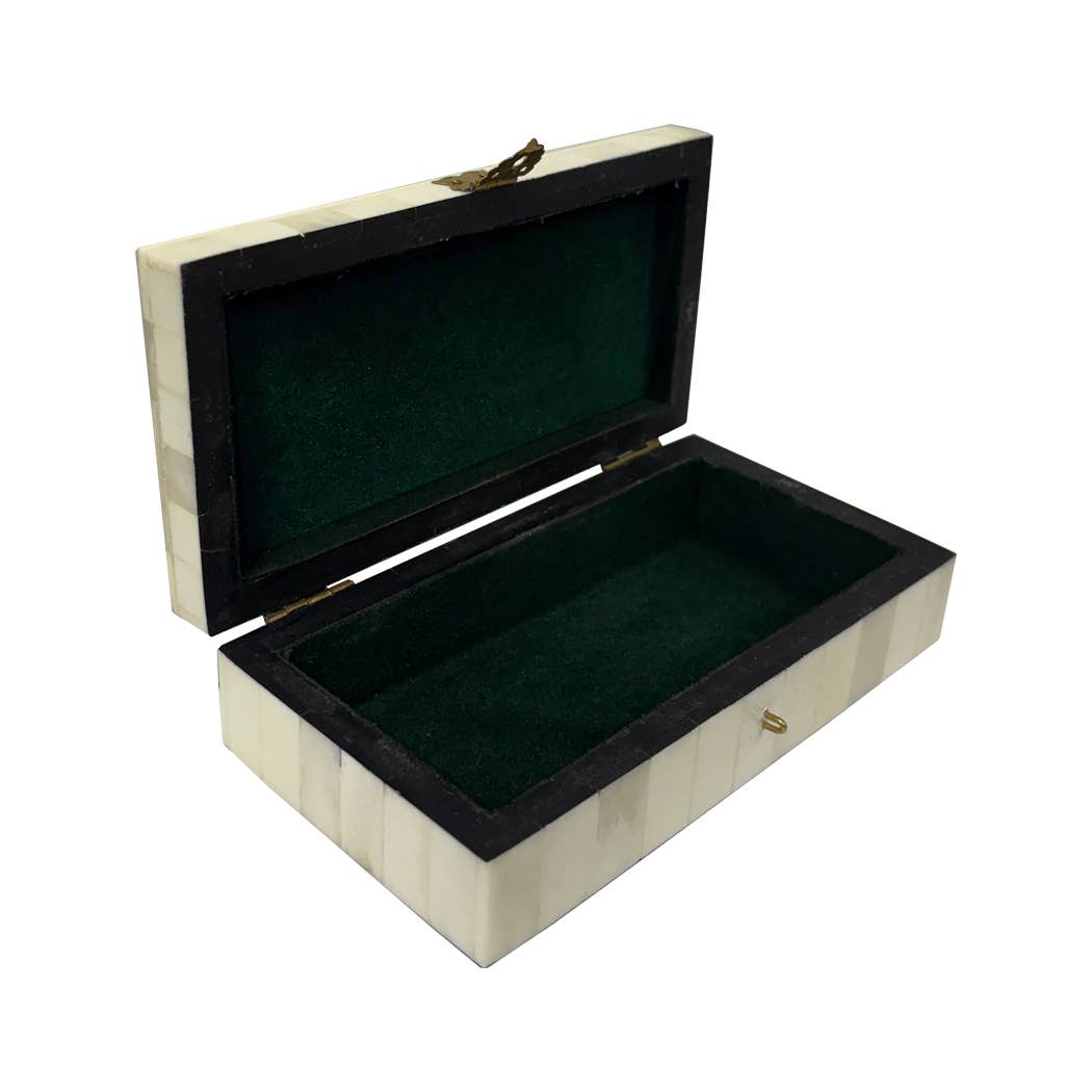 Open bone-inlay keepsake box showing its green felt-lined interior and hinged lid