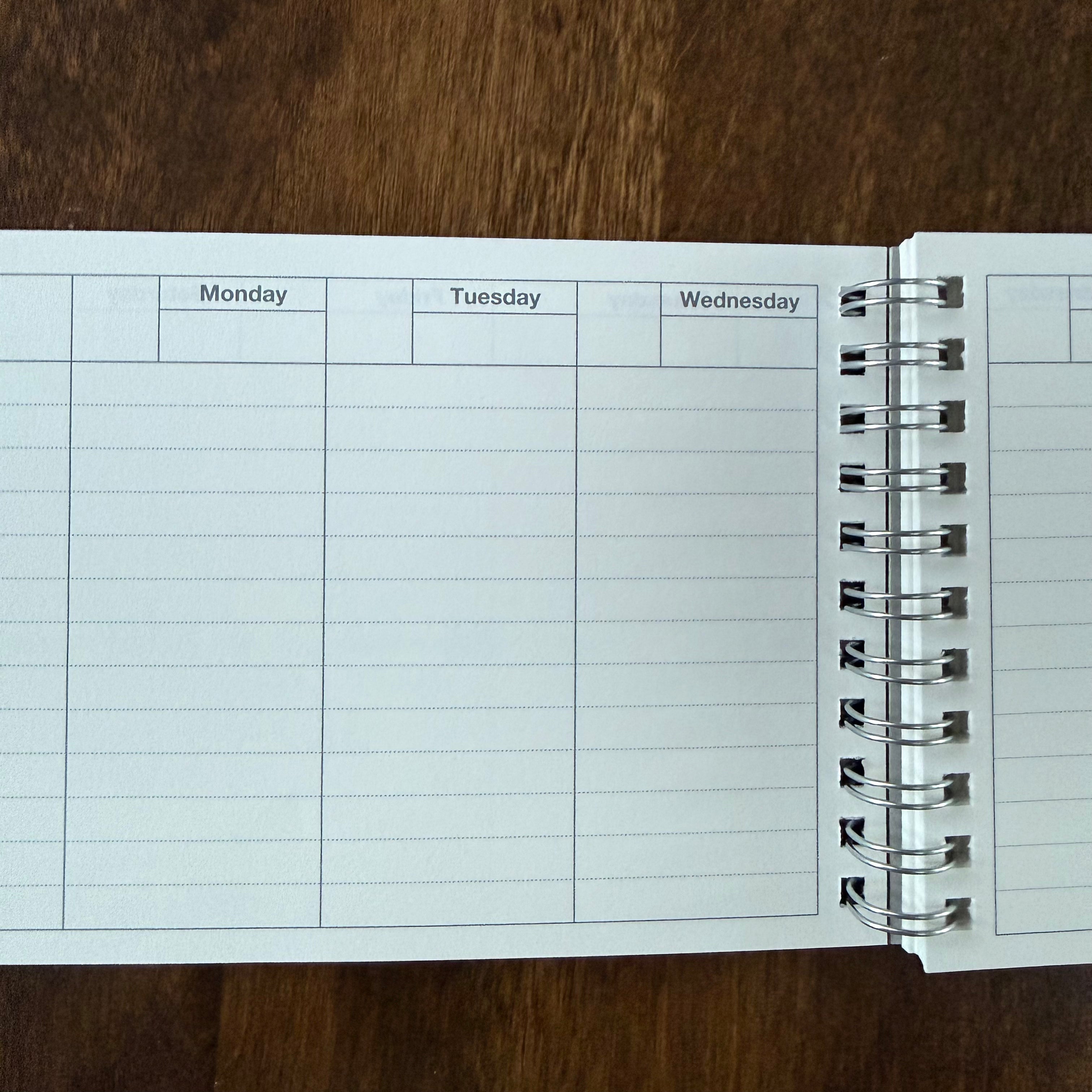 MARK’S Dayfree planner open to the undated Monday through Wednesday columns, with date boxes and ruled writing space.