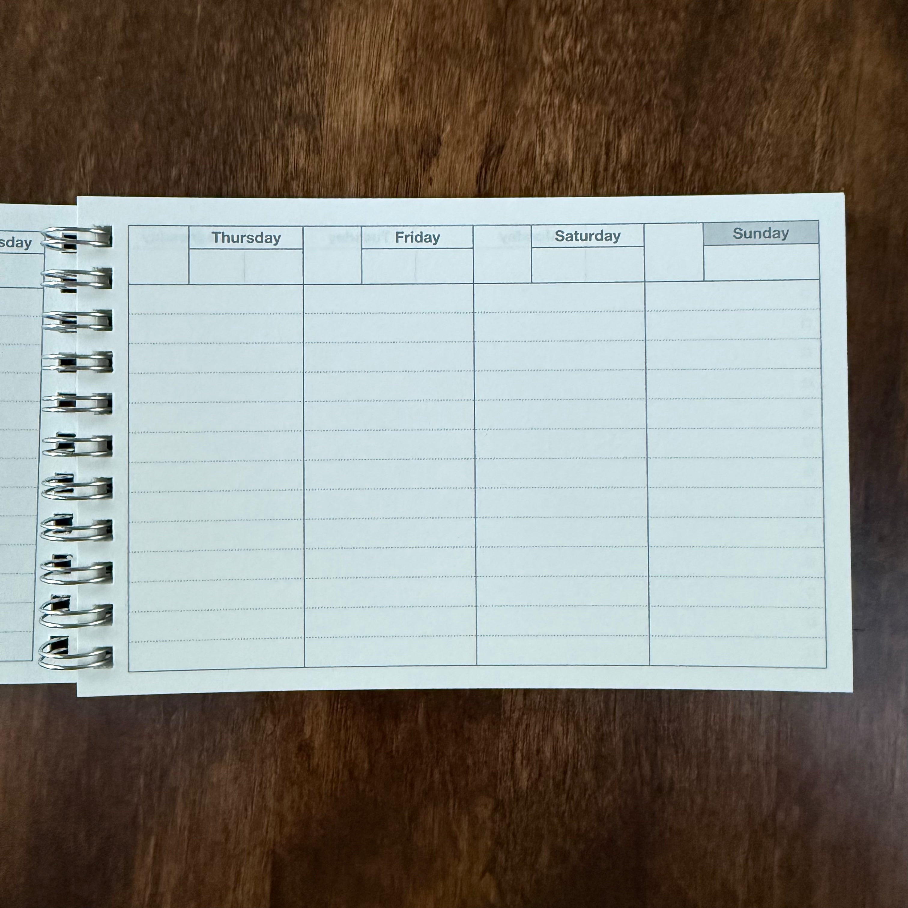MARK’S Dayfree planner open to the undated Thursday through Sunday columns, with ruled writing space and wire binding.