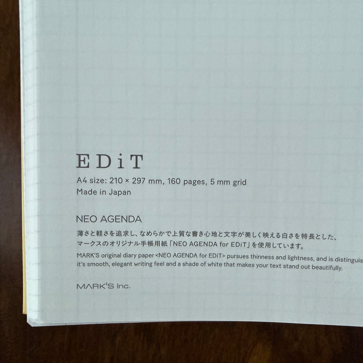 Close-up of the MARK’S EDiT A4 notebook’s printed paper information, identifying NEO AGENDA for EDiT, 160 pages, and 5 mm grid ruling.