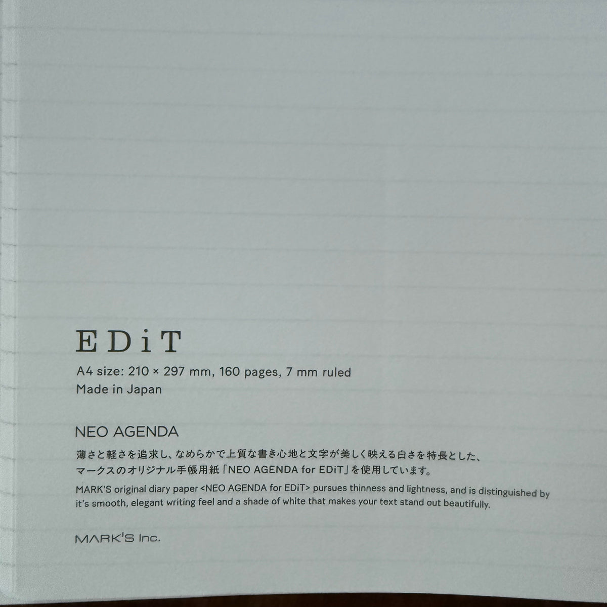 Close-up of the MARK’S EDiT notebook’s NEO AGENDA paper information, with A4 dimensions, 160 pages, and 7 mm ruling.