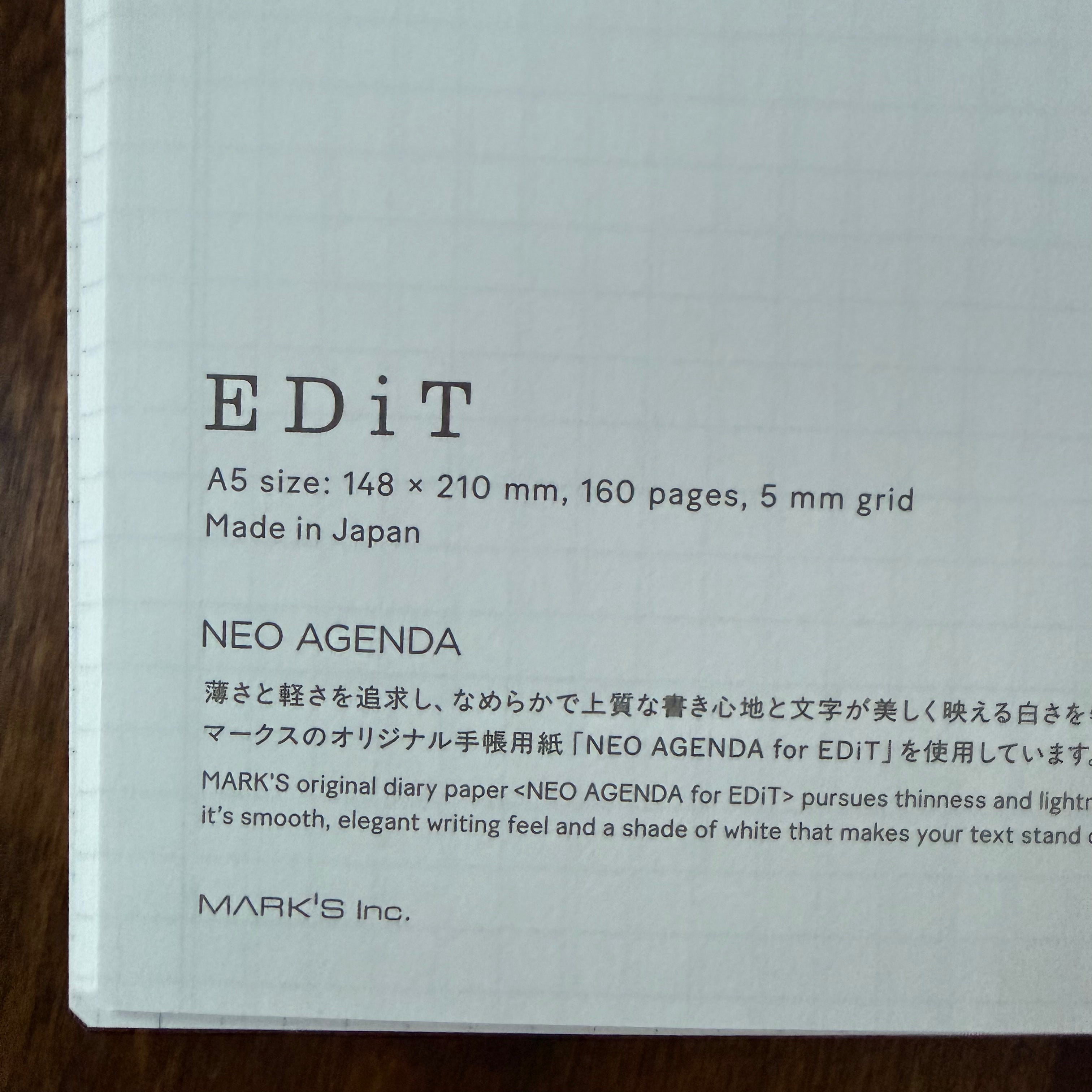 Close-up of the MARK’S EDiT notebook’s printed specifications: A5, 148 × 210 mm, 160 pages, 5 mm grid, and NEO AGENDA paper made in Japan.