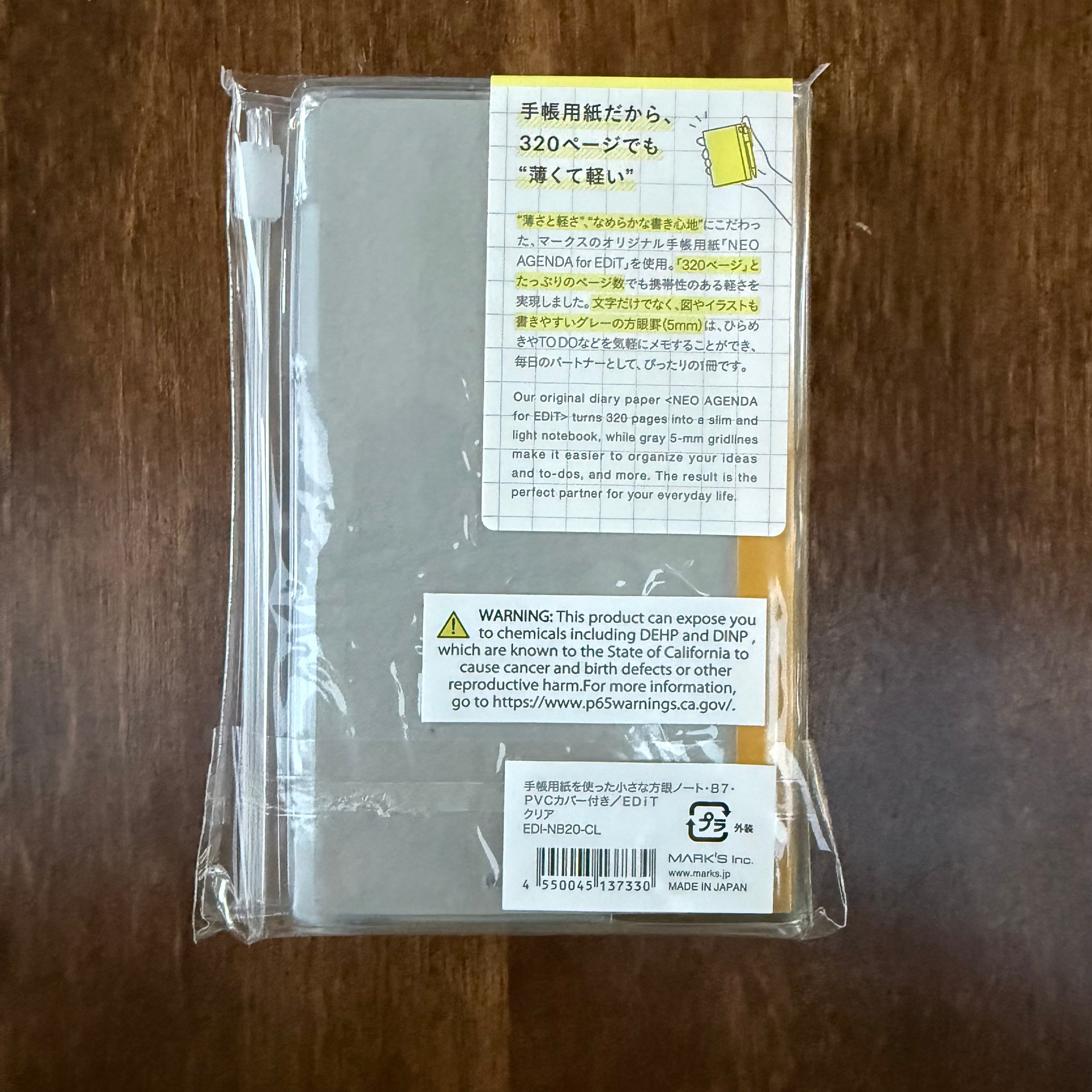 Back of the packaged MARK’S EDiT B7 Clear notebook, showing paper information, the product label, and the California warning label.