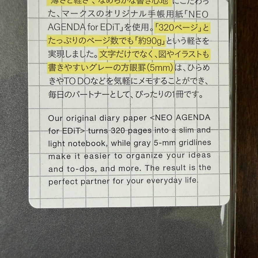 Close-up of the MARK'S EDiT B7 notebook label describing NEO AGENDA paper, 320 pages, approximately 90 g weight, and 5 mm gray grid