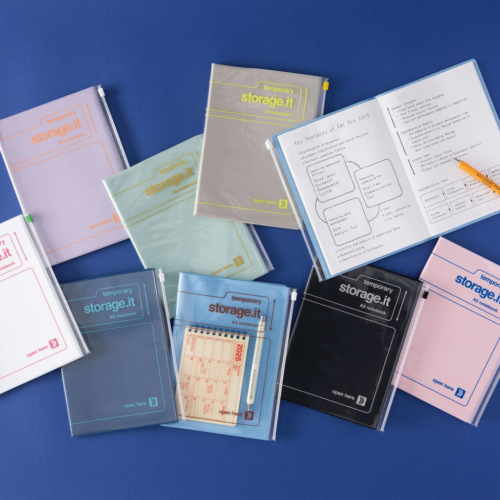 MARK'S Storage.it A5 notebooks in assorted colors, including purple, with an open notebook and stationery stored in a zip cover