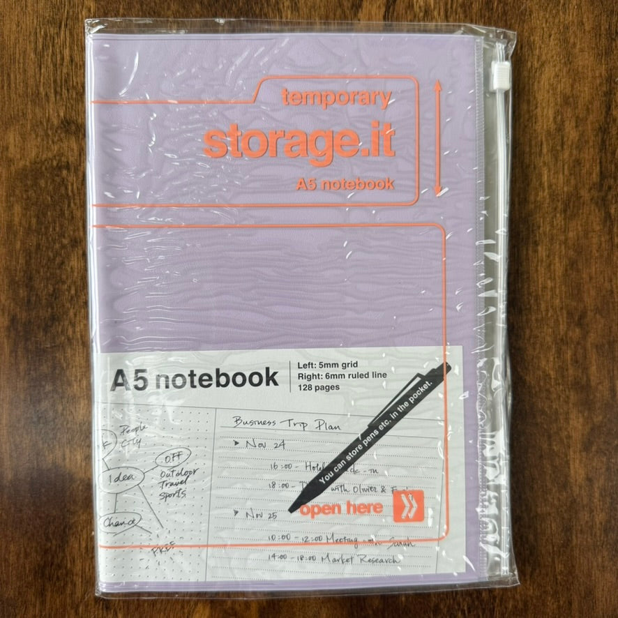 Purple MARK'S Storage.it A5 refillable notebook in retail packaging, with orange lettering and a slide-zip storage cover