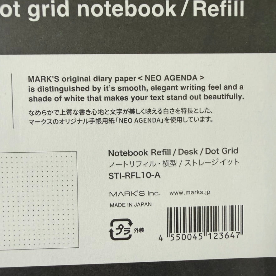 Close-up of the MARK'S Storage.it Desk refill label with NEO AGENDA paper information, model STI-RFL10-A, and made-in-Japan marking