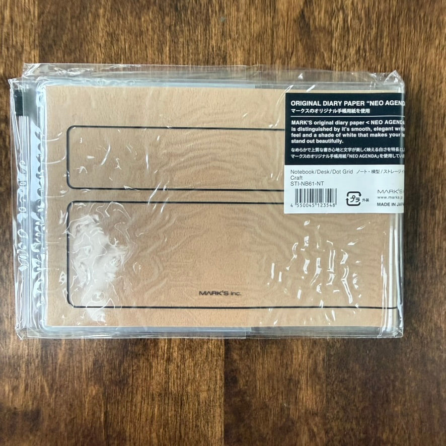 Back of the Craft MARK'S Storage.it Desk notebook packaging, showing the tan cover and NEO AGENDA paper label