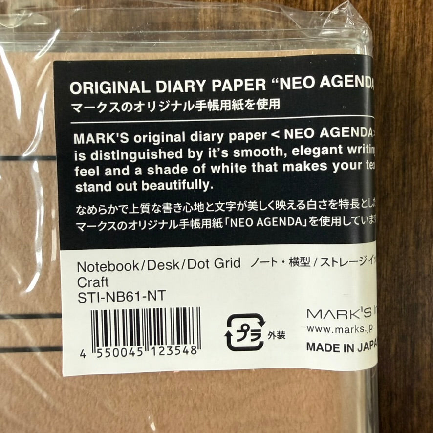 Close-up of the Craft MARK'S Storage.it Desk notebook label with NEO AGENDA paper information, model STI-NB61-NT, and made-in-Japan marking