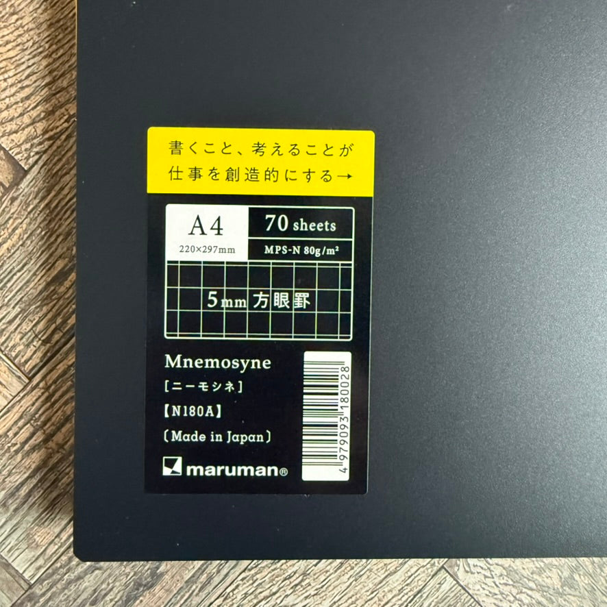 Close-up of the Maruman Mnemosyne N180A label: A4, 70 sheets, 80 gsm, 5 mm grid, made in Japan