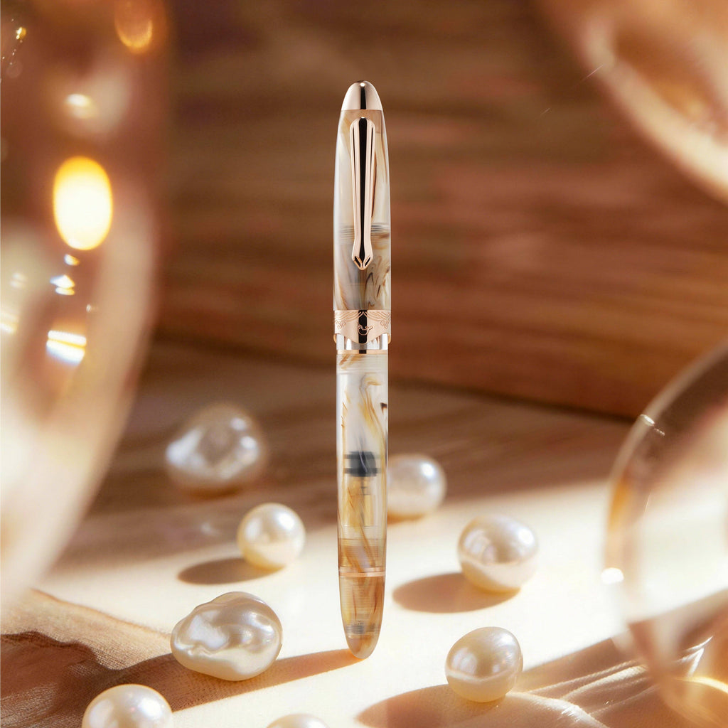 Nahvalur Horizon Pearl fountain pen standing capped among pearls in warm light