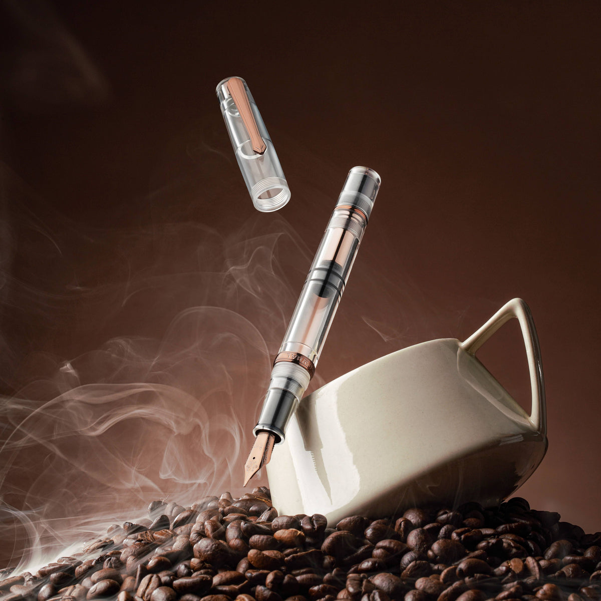 Nahvalur Original Fall fountain pen with a white coffee cup, coffee beans, and its cap in the air