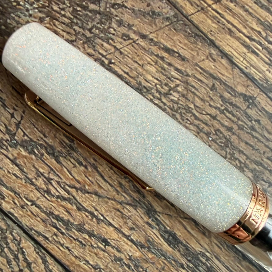 Detail of the iridescent shimmer in the Nahvalur Matira Quartz acrylic cap