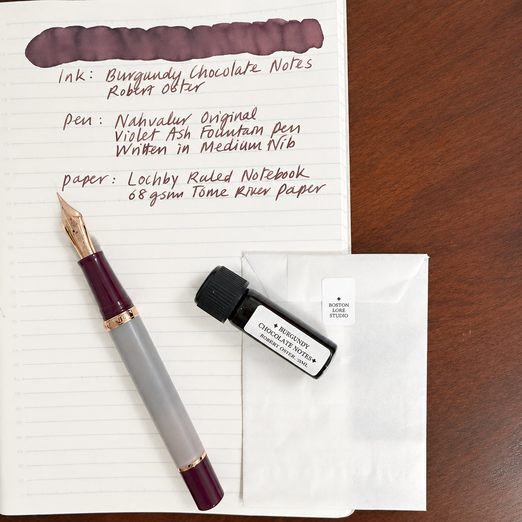 Nahvalur Original Violet Ash fountain pen on a handwritten ink sample page with a Boston Lore Studio 5 mL ink vial