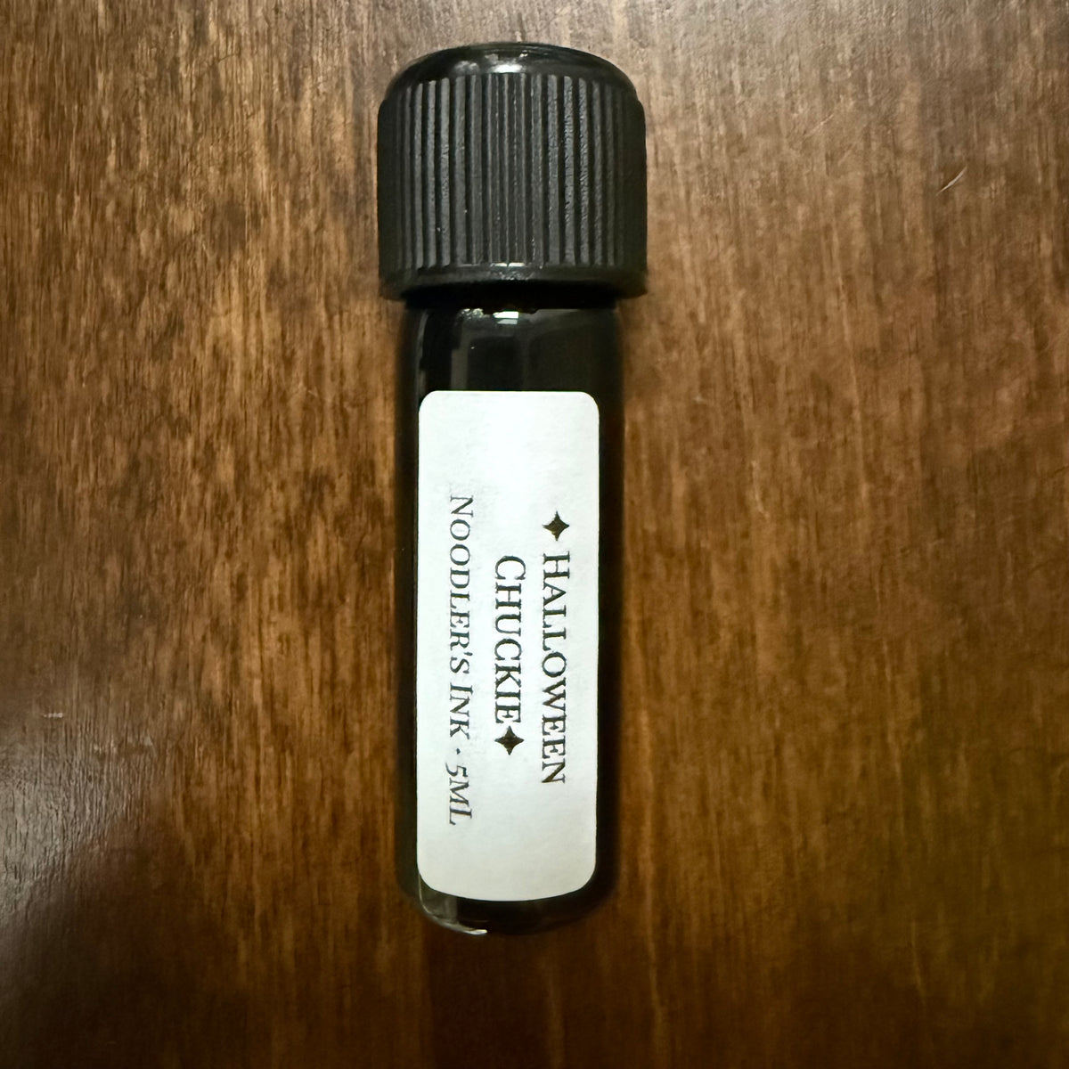 Noodler's Halloween Chuckie 5 mL Archive Bottle standing upright with its label