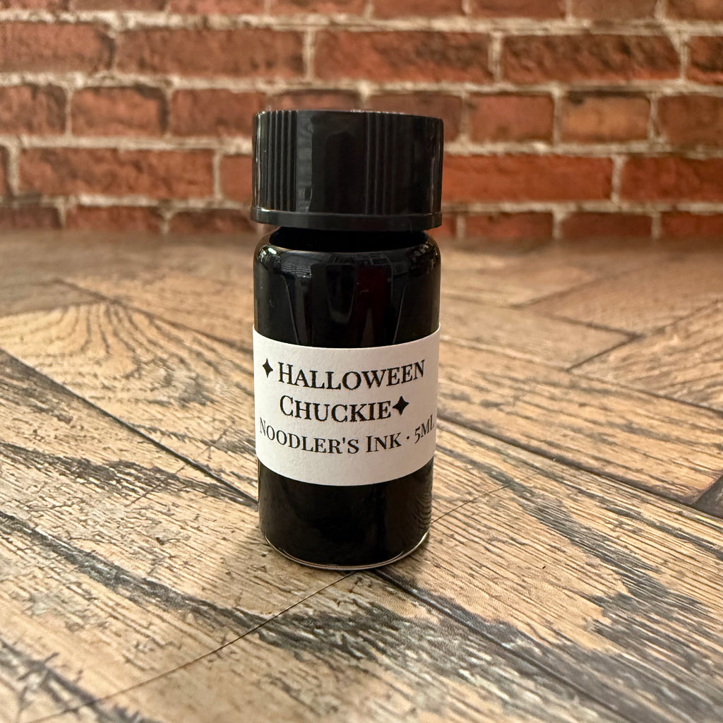 Close-up of the Halloween Chuckie Noodler's Ink 5 mL glass specimen bottle label