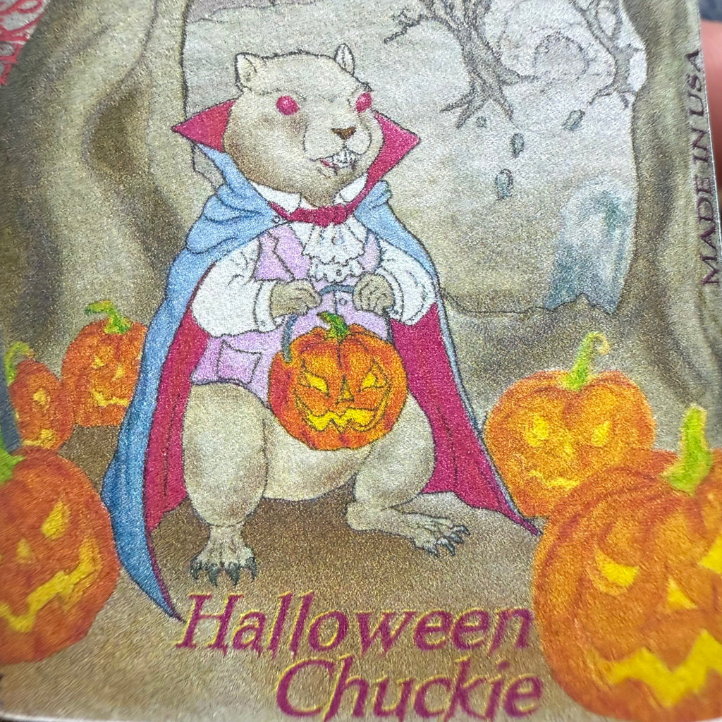 Noodler's Halloween Chuckie label art of a caped creature holding a jack-o'-lantern among pumpkins
